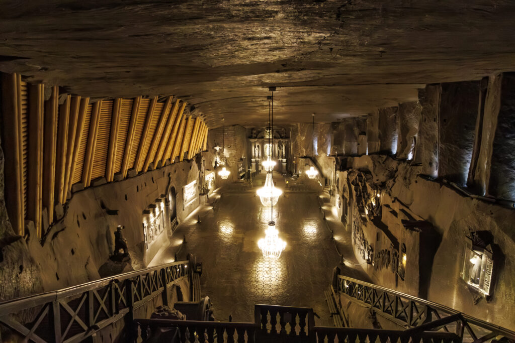 cathedral built inside wieliczka salt mine as seen from above near krakow poland, with chandeliers prominent in the center