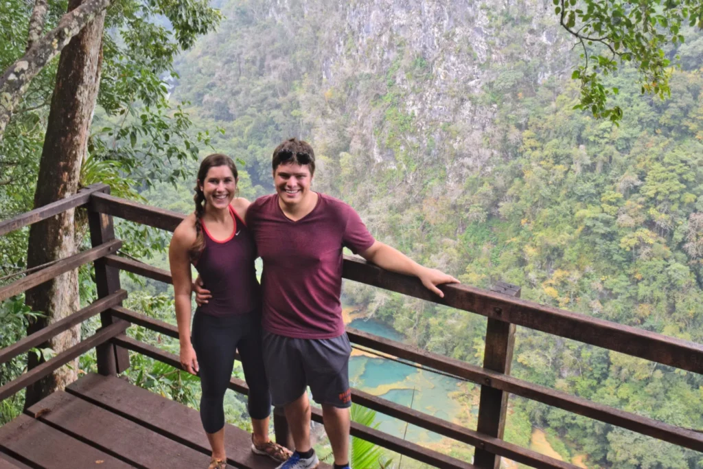 kate storm and jeremy storm standing on a deck overlooking semuc champey during 2 weeks in guatemala itinerary