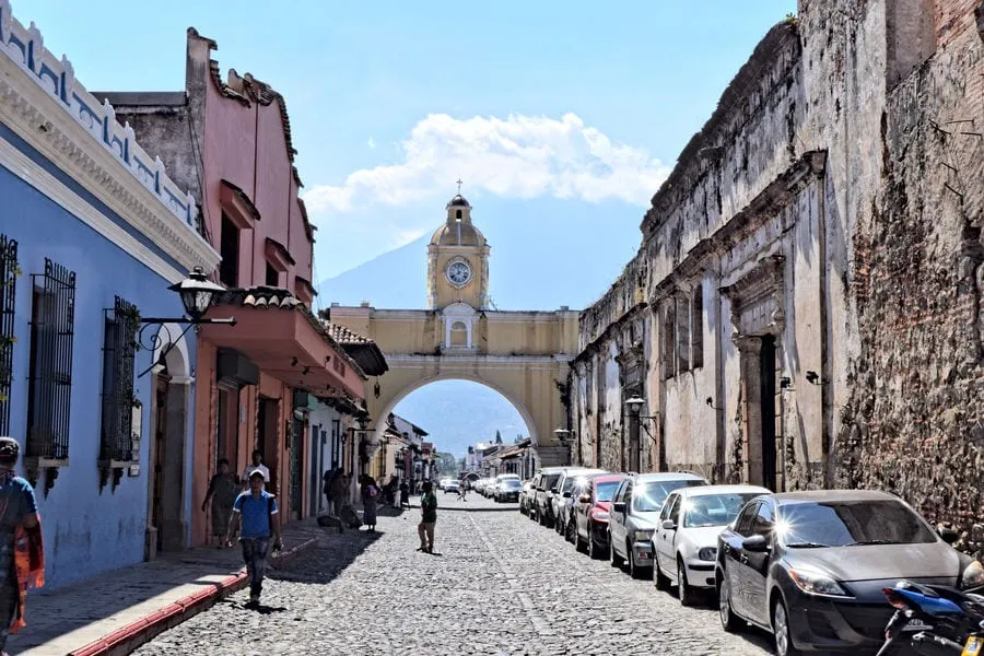 view of famous yellow gate in antigua guatemala, as seen during guatemala in 2 weeks itinerary
