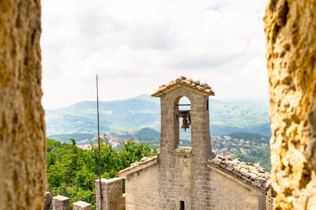 view of bell tower through stone tower walls as seen when visiting san marino