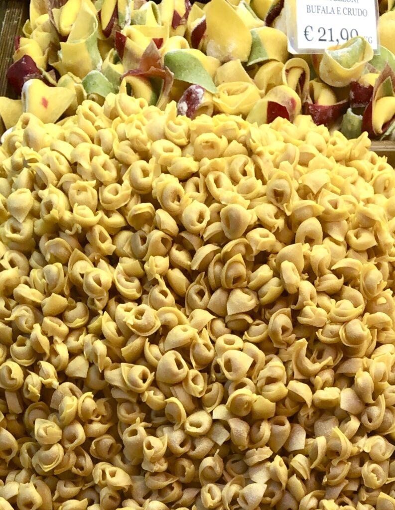 tortellini for sale in a market as seen when traveling to bologna italy