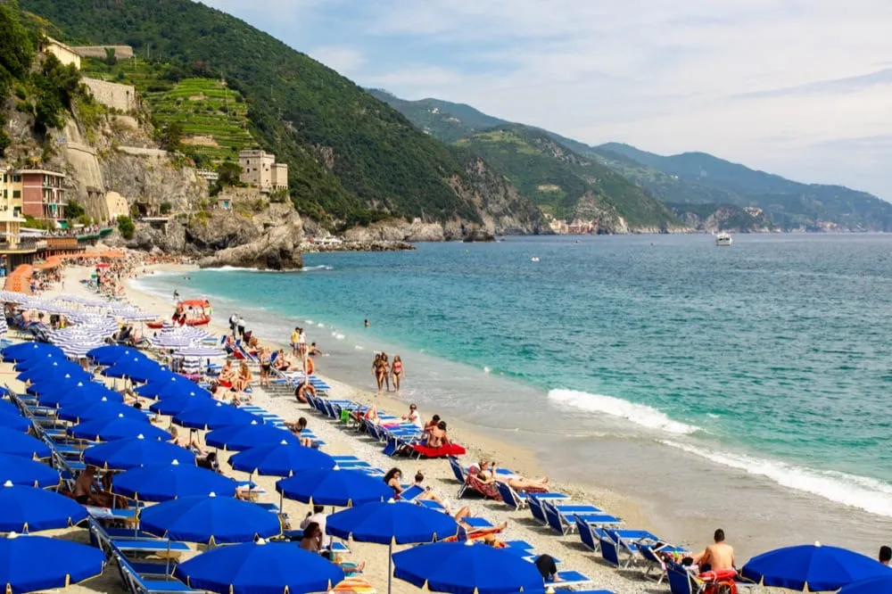 Beach at Monterosso al Mare, Cinque Terre set up with a lido for the summer, a fun stop during a 2 weeks in italy itinerary