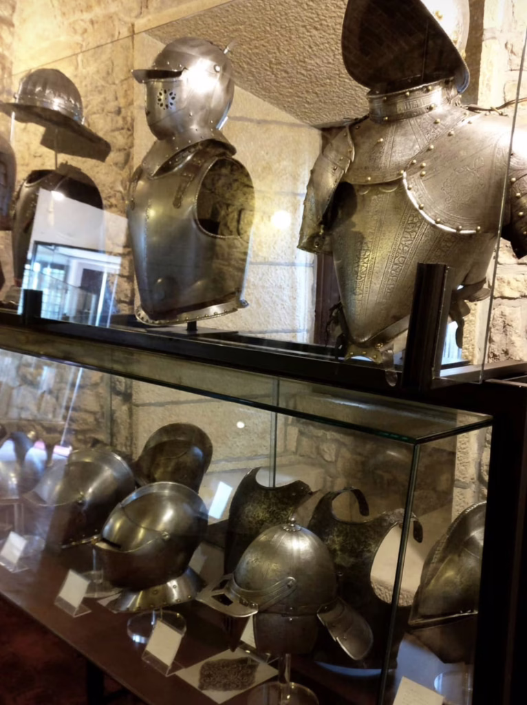 collection of suits of armor on display at the museum of ancient weapons in san marino