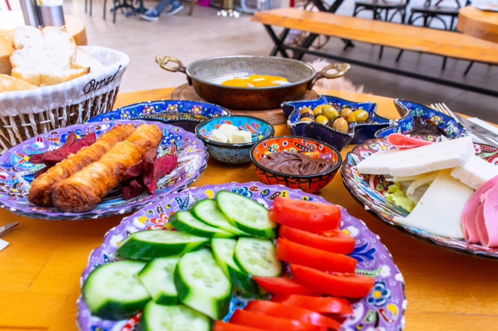 classic turkish breakfast served on a round table with colorful dishes when visiting istanbul turkiye