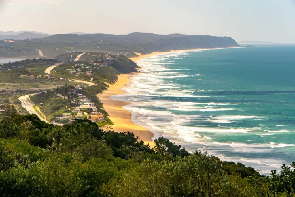 view of wilderness beach along the garden route in south africa with road visible on the left