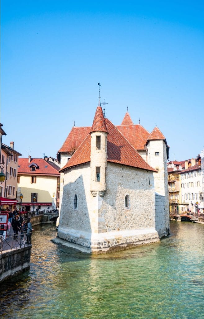 palais de l'isle in annecy france surrounded by canals on either side, one of the best things to see in annecy france