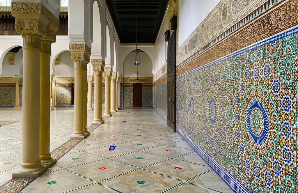 mosaics lining a hallway in the interior of the grand mosque of paris, a fun hidden gem paris