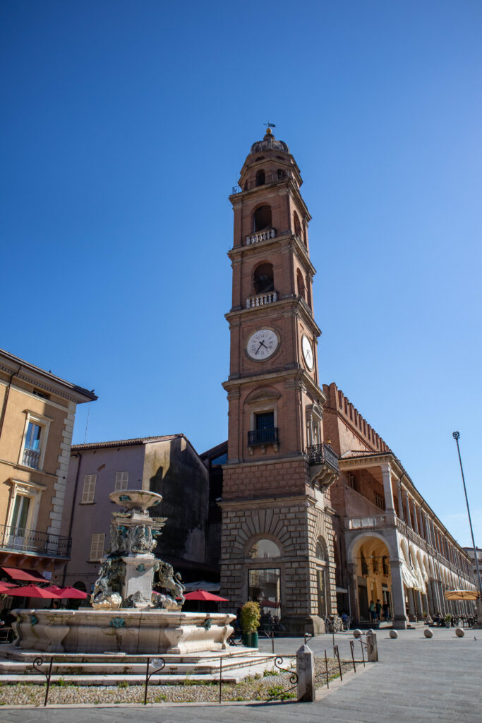 clock tower in main piazza of faenza italy, a great place to visit in emilia romagna