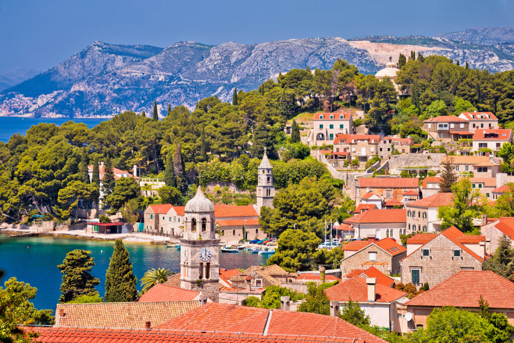 view of cavtat croatia from above with the sea visible to the left on a sunny day, one of the best places to go in europe off the beaten path