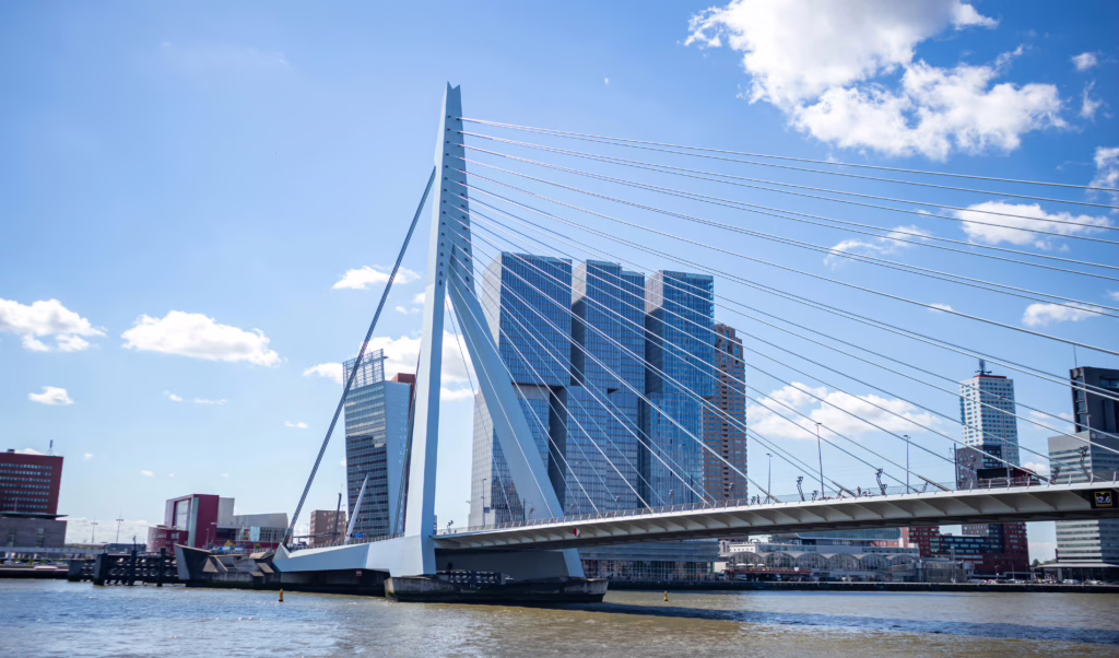 photo of erasmus bridge and modern architecture in rotterdam the netherlands