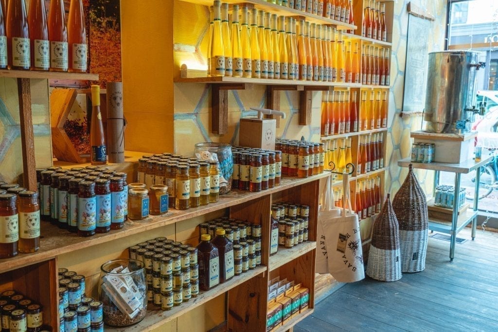 interior of savannah bee company showing shelves of different honeys from sale, one of the best places for shopping in savannah ga