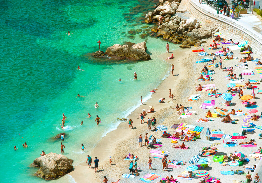 view of crowded beach on the french riviera from above