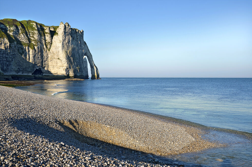 cliffs of etretat as seen from the beach, etretat is one of the best places to visit in france