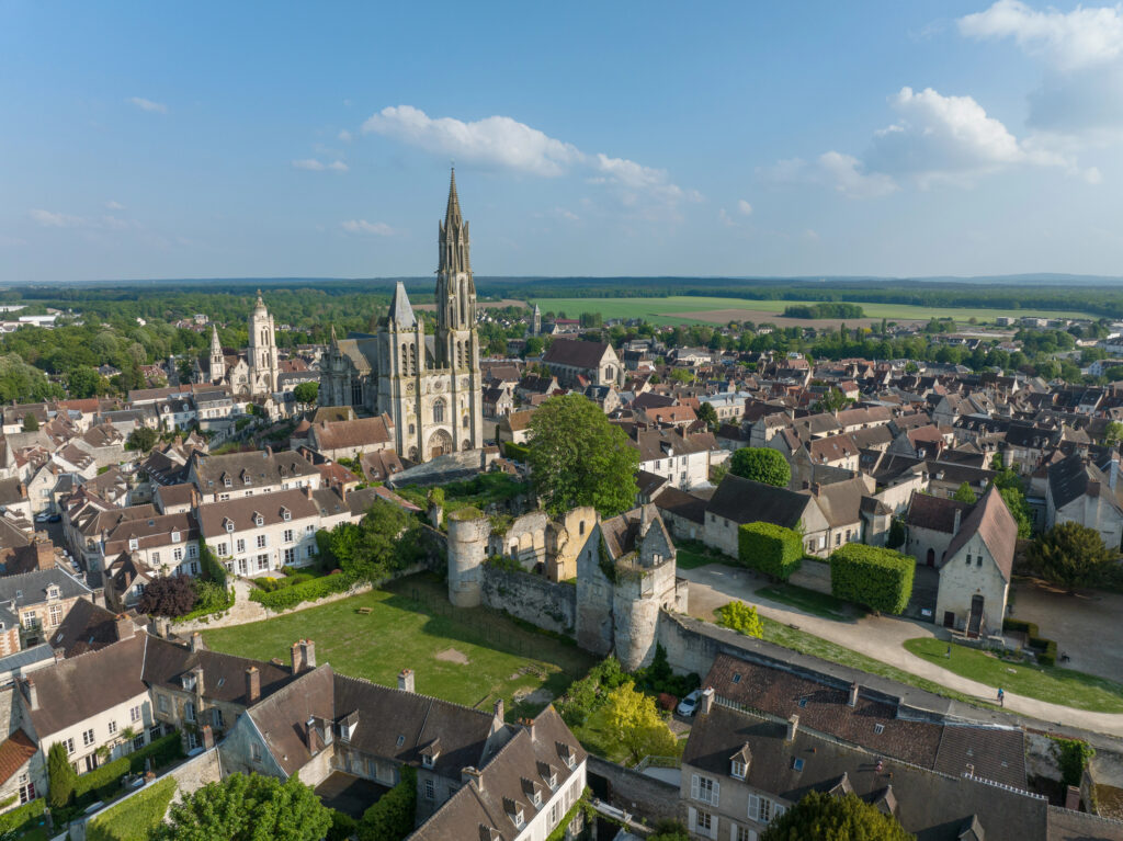 aerial view of senlis, one of the most beautiful small towns in france, with its gothic cathedral and town walls prominent in the image