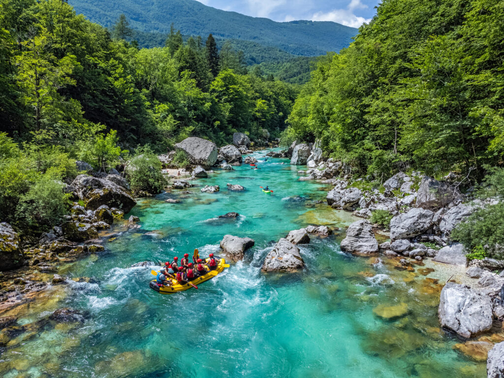 view of whitewater rafters in the soca river when visiting slovenia travel guide