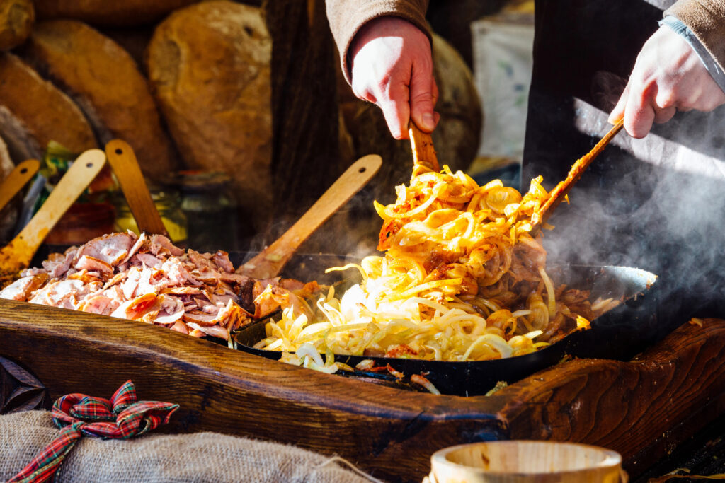 krakow poland christmas market stall serving grilled meat