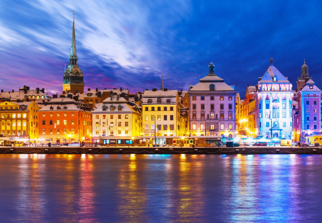 view of stockholm sweden from the water on a winter night