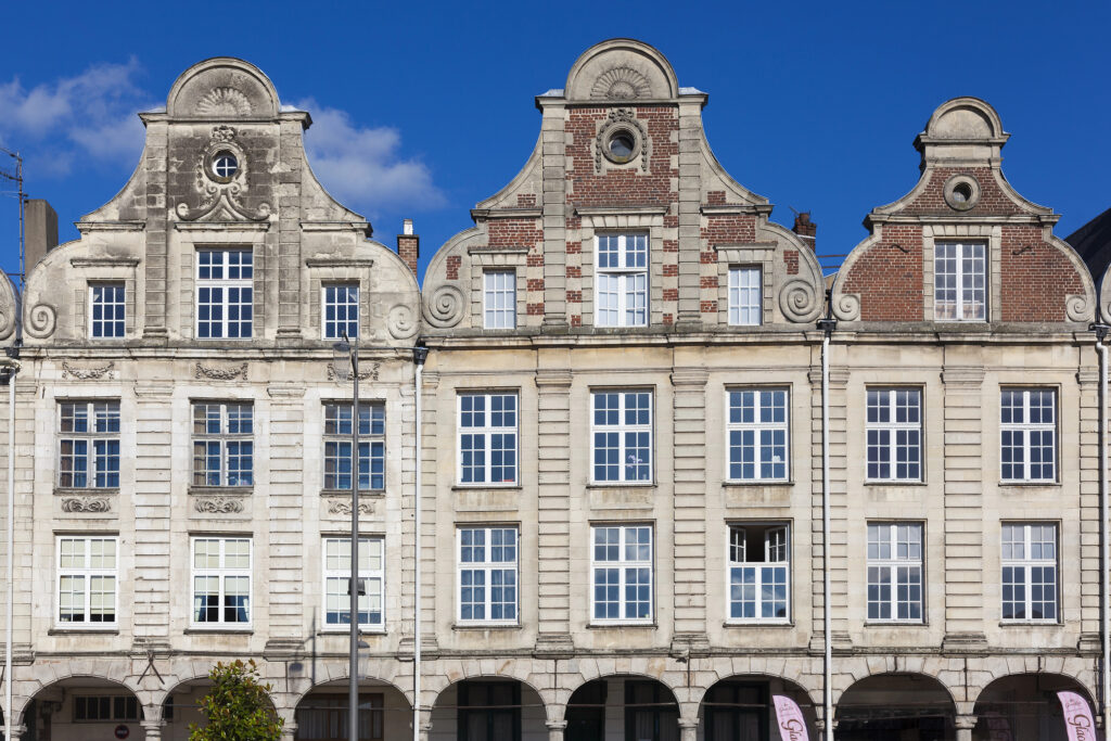 front facades of buildings in arras place, an underrated paris day trip by train