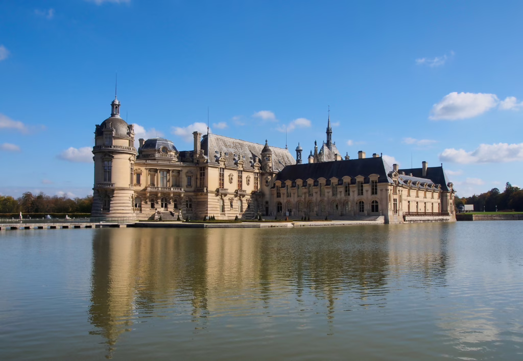 chateau de chantilly as seen from across the water, one of the easiest day trips from paris by train