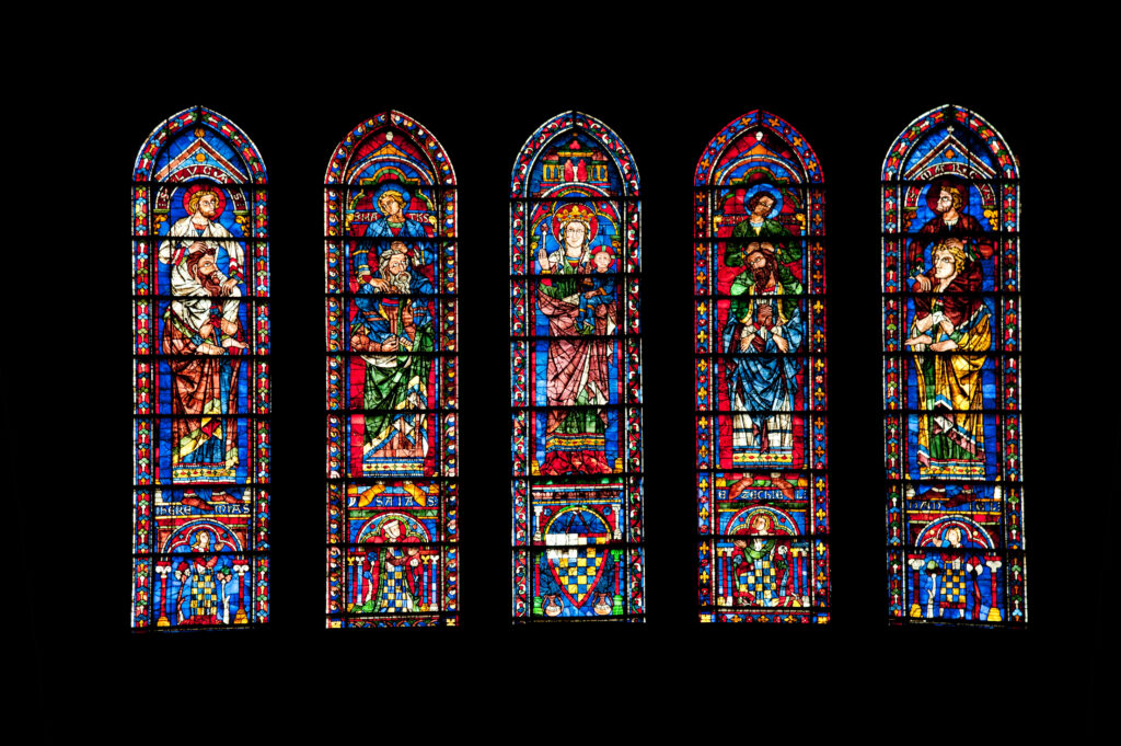 stained glass windows inside chartres cathedral shown in silhouette
