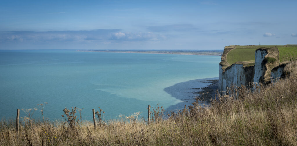 views of the sparkling sea from the cliffs of Mers-Les-Bains france on a sunny day