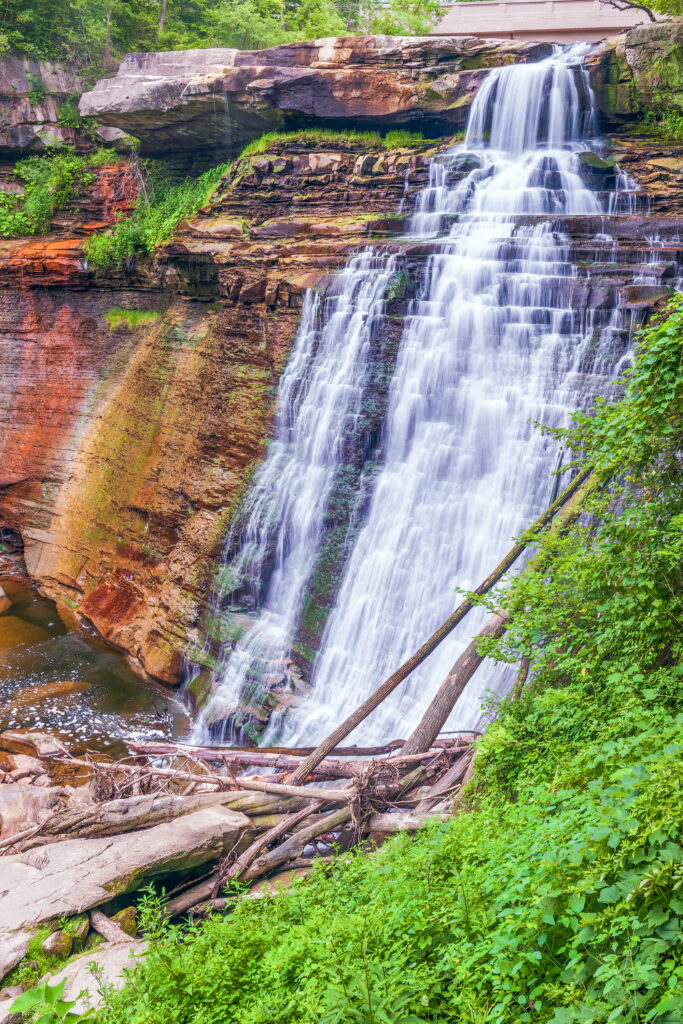 brandywine falls in cuyahoga valley national park with green foliage in the foreground, a memorable usa national park to visit