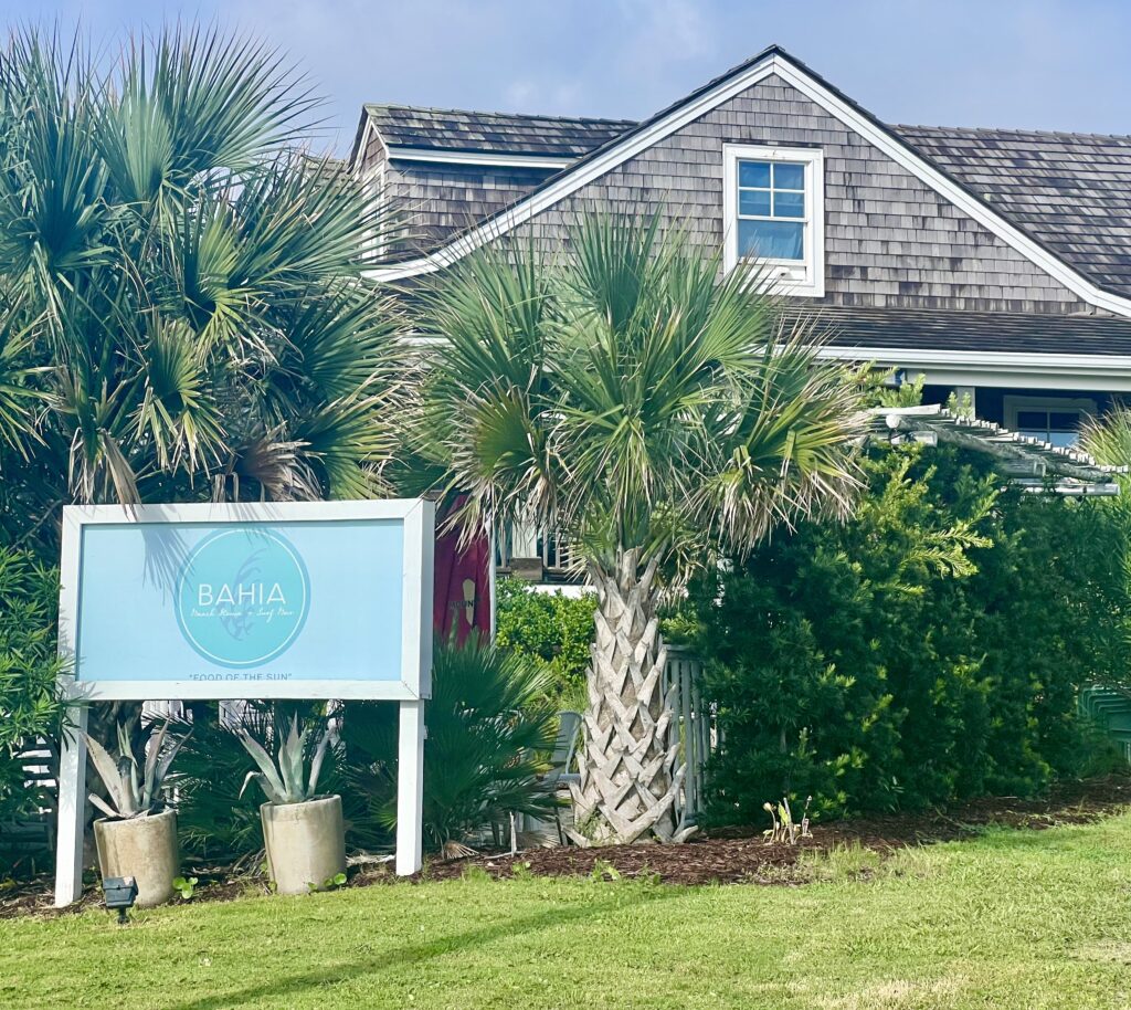 bahia beach house in atlantic beach nc as seen from the outside, sign with restauarnts name in the foreground