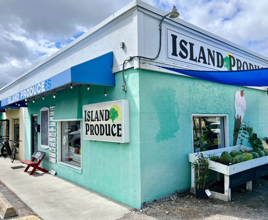 front facade of island produce store in atlantic beach north carolina, painted teal