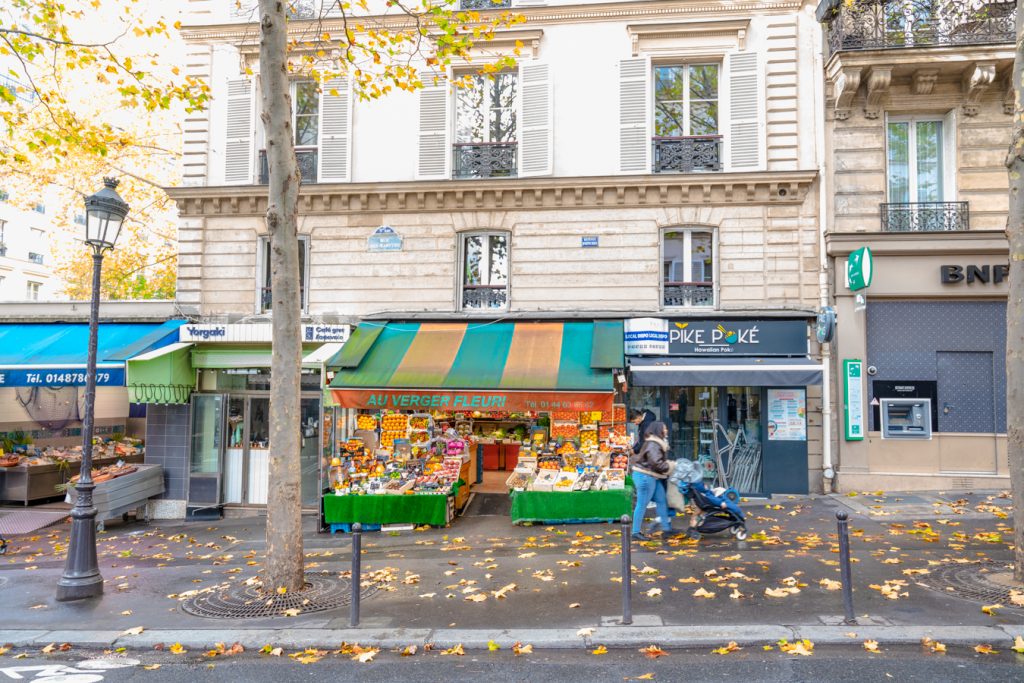 produce stand on rue des martyrs in paris france in the fall