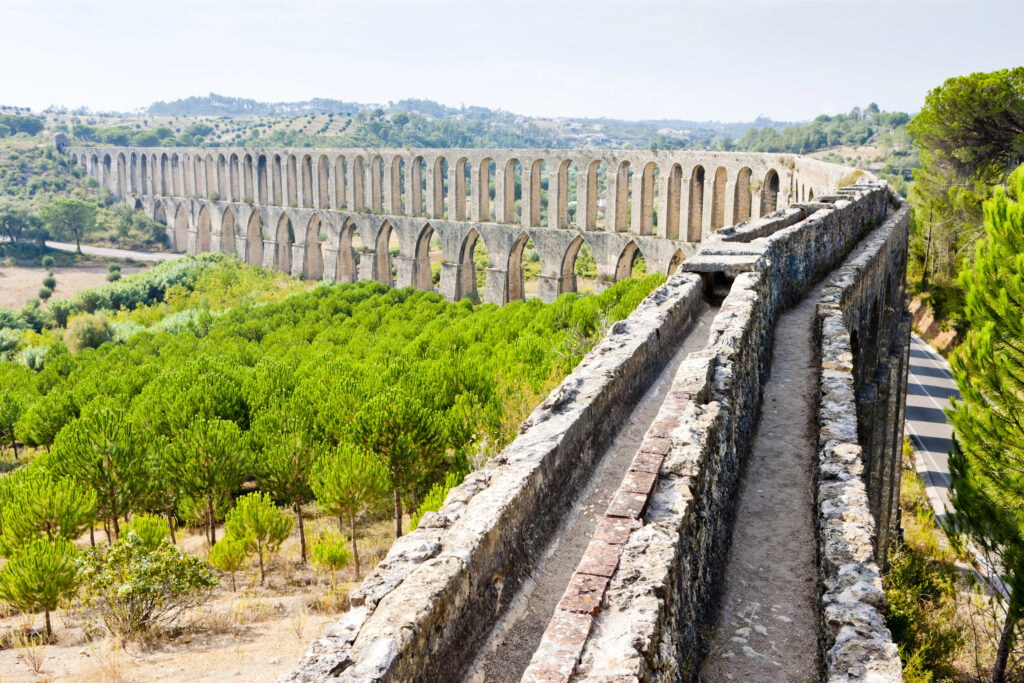 view from the top of the Pegões aqueduct in tomar portugal with aqueduct stretching into the distance