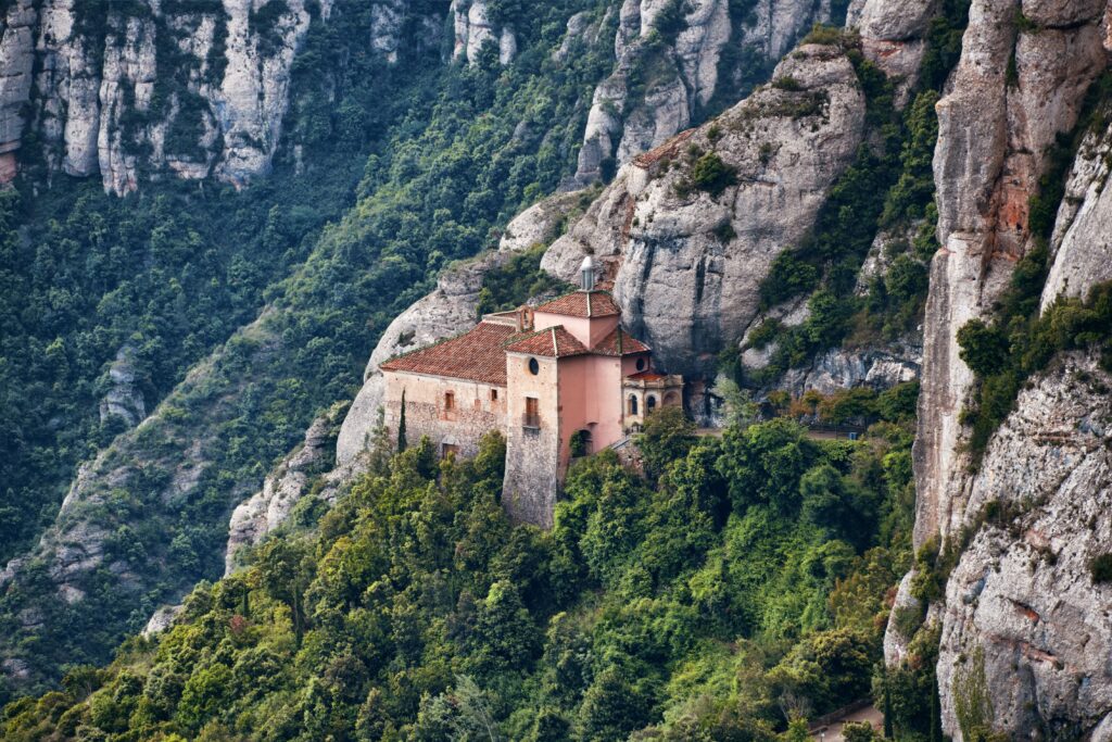 montserrat monastery as seen from afar, nestled in the mountains of catalonia spain