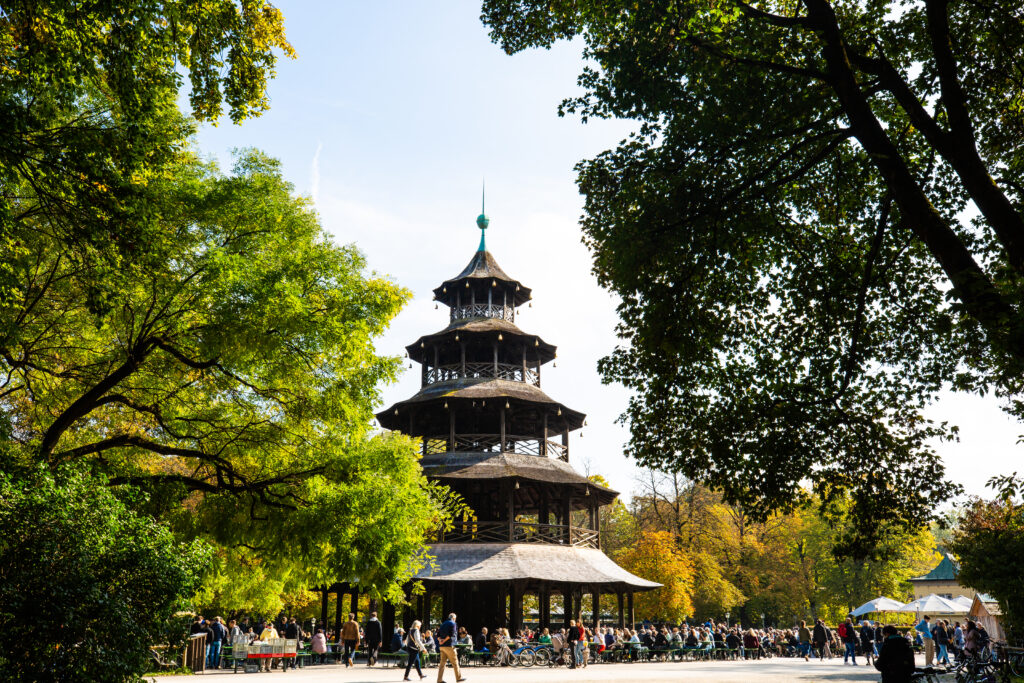 chinese tower in munich englischer garden surrounded by trees, one of the must see places in munich germany