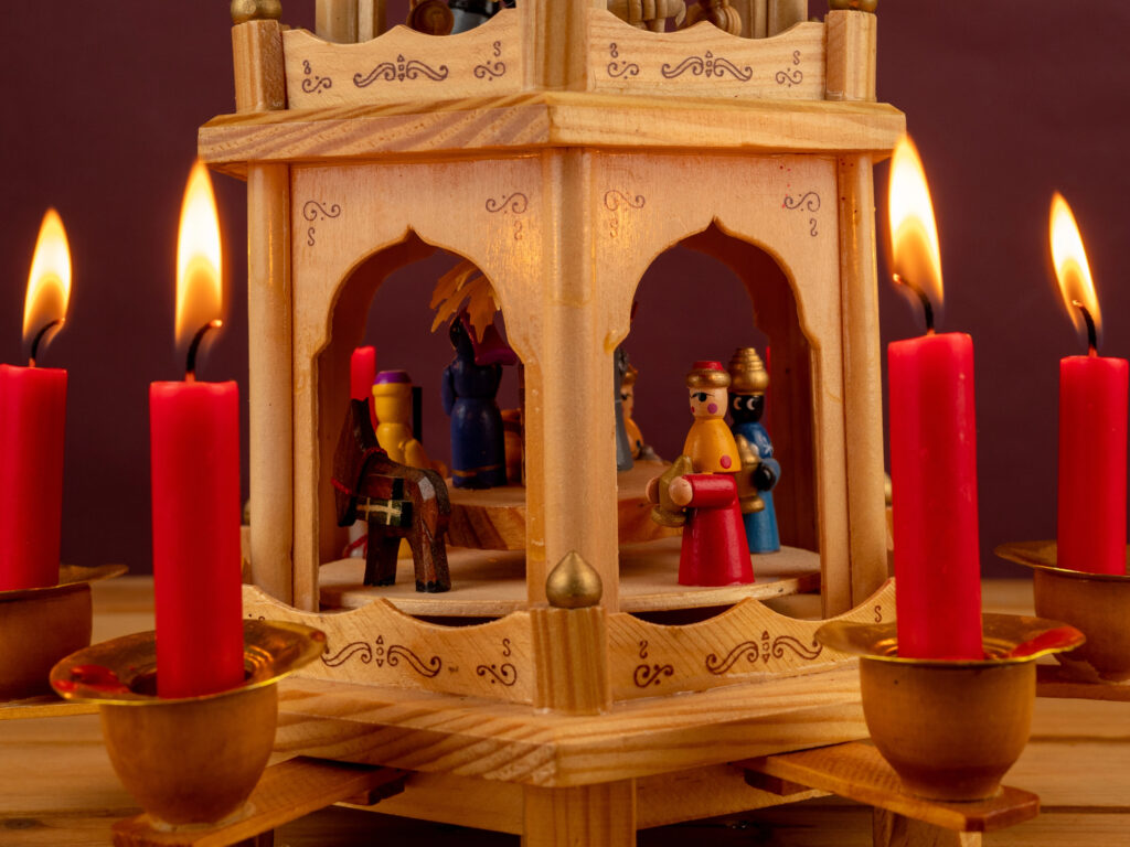 small german christmas pyramid being powered by lit red candles