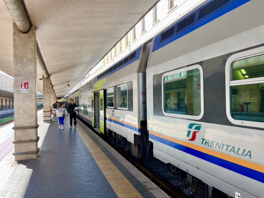 trenitalia train parked at a platform in firenze santa maria novella