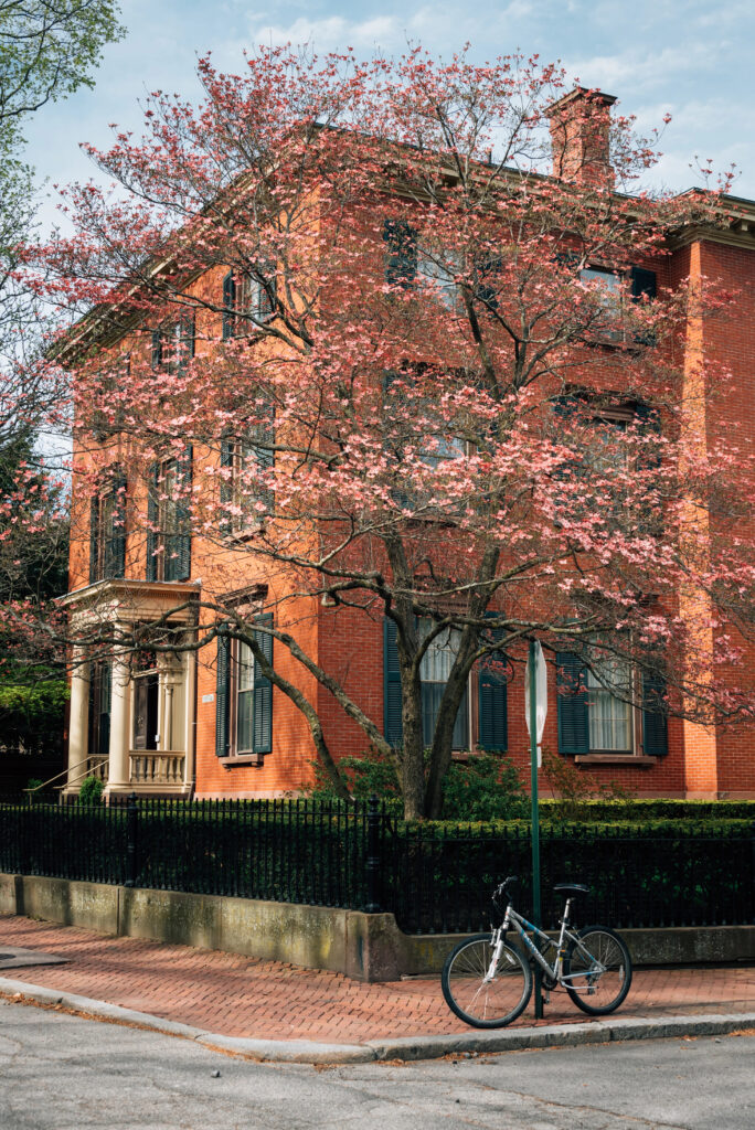 view of a colonial home on a spring day in college hill providence road island, one of the easiest boston day trip ideas