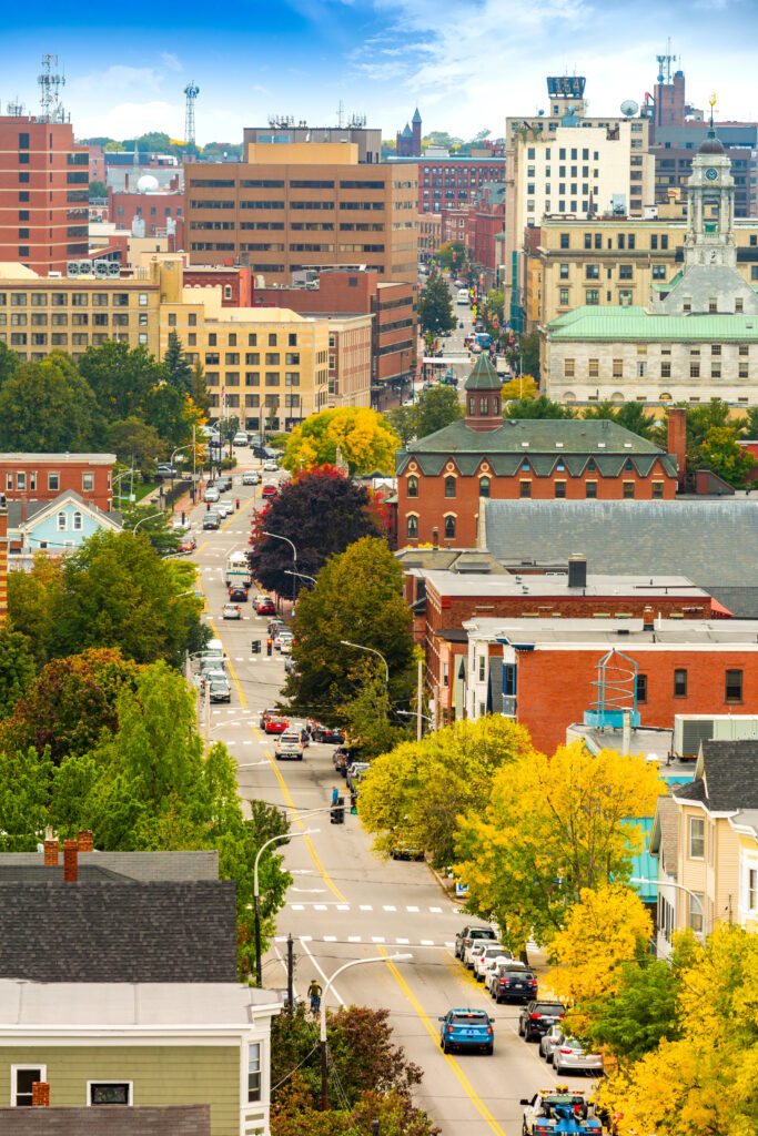 aerial view of downtown portland maine in the early fall, with some yellow leaves on the trees