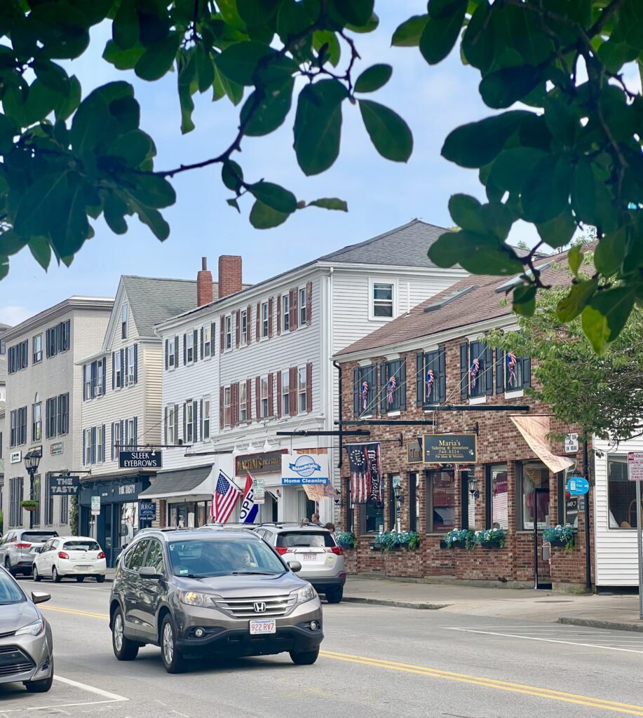 plymouth center in as seen on a summer day in plymouth massachusetts, with cars visible in front of historic buildings