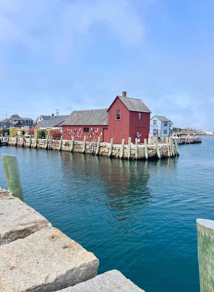 red building named motif no. 1 in rockport massachusetts as seen from a dock across the water