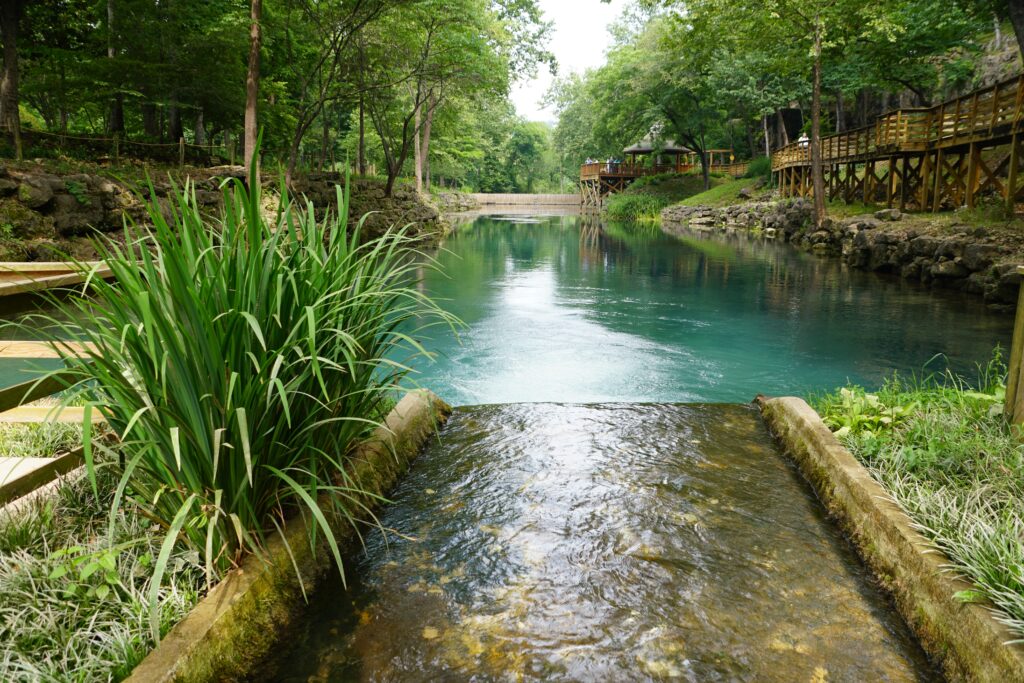 bright blue water of blue spring in eureka springs arkansas