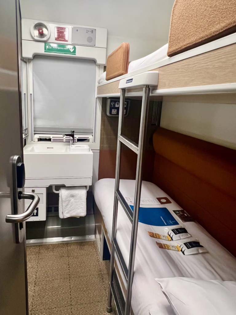 view of caledonian sleeper train club en suite cabin room as seen when we first entered