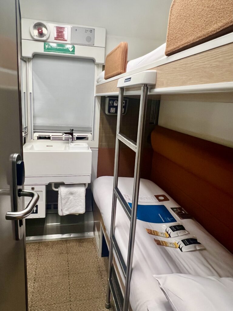 view of caledonian sleeper train club en suite cabin room as seen when we first entered