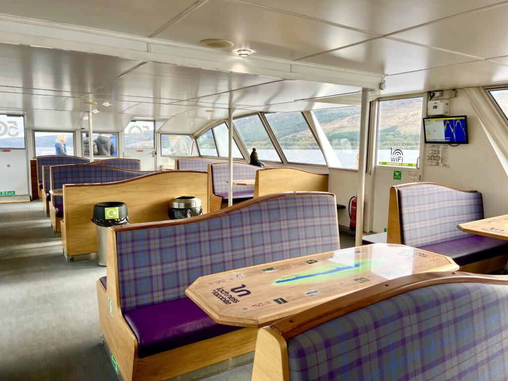 lower deck of loch ness cruise boat showing empty booths