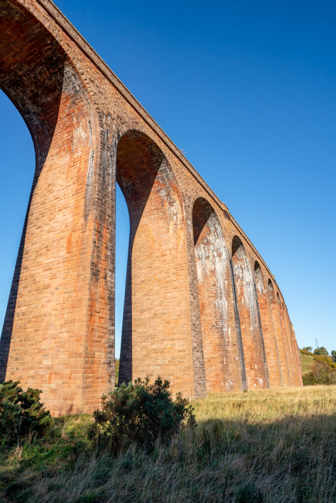 view of the culloden viaduct from very close to the structure on a sunny day when visiting inverness scotland