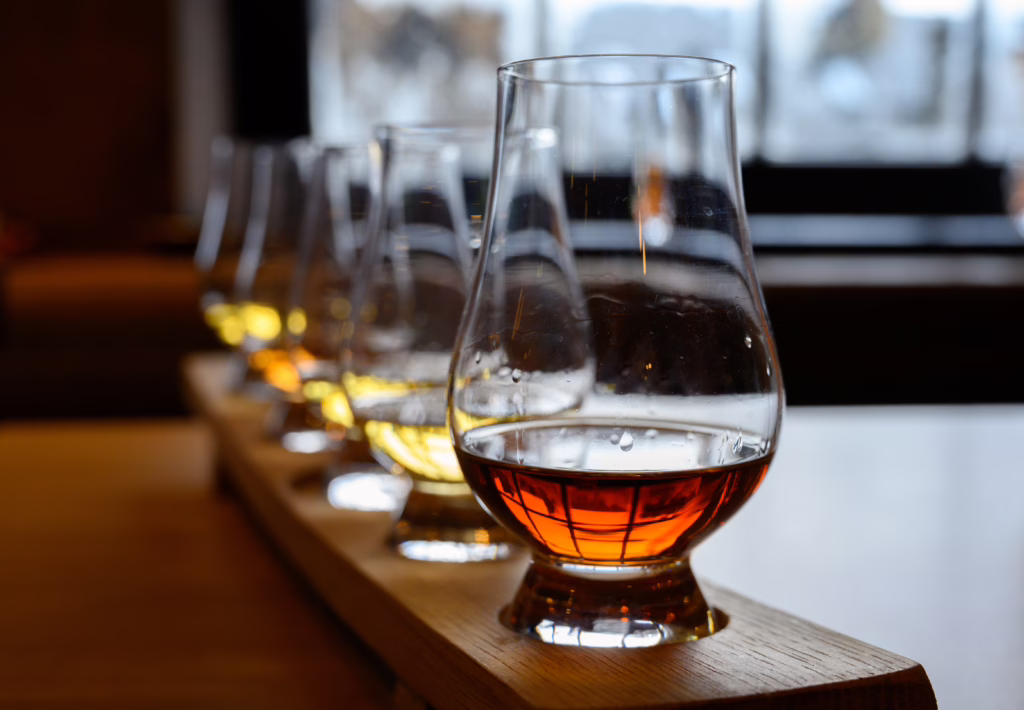 flight of scottish whisky served at a tasting, whisky is one of the best souvenirs from scotland