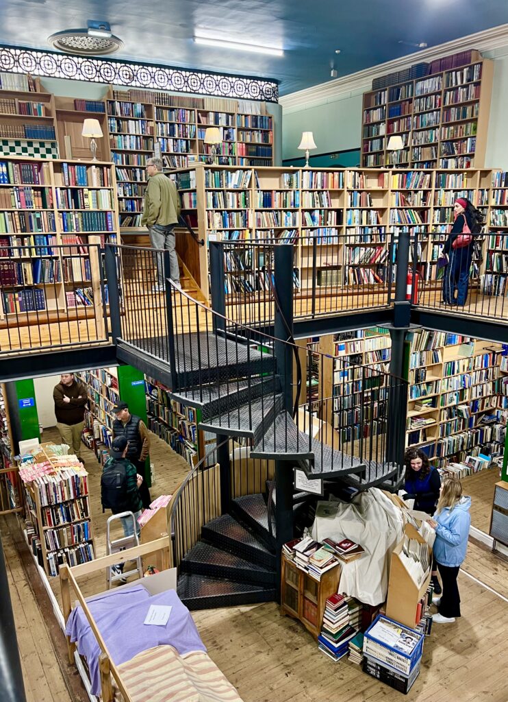 interior of leakeys bookshop inverness scotland showing black spiral staircase surrounded by books