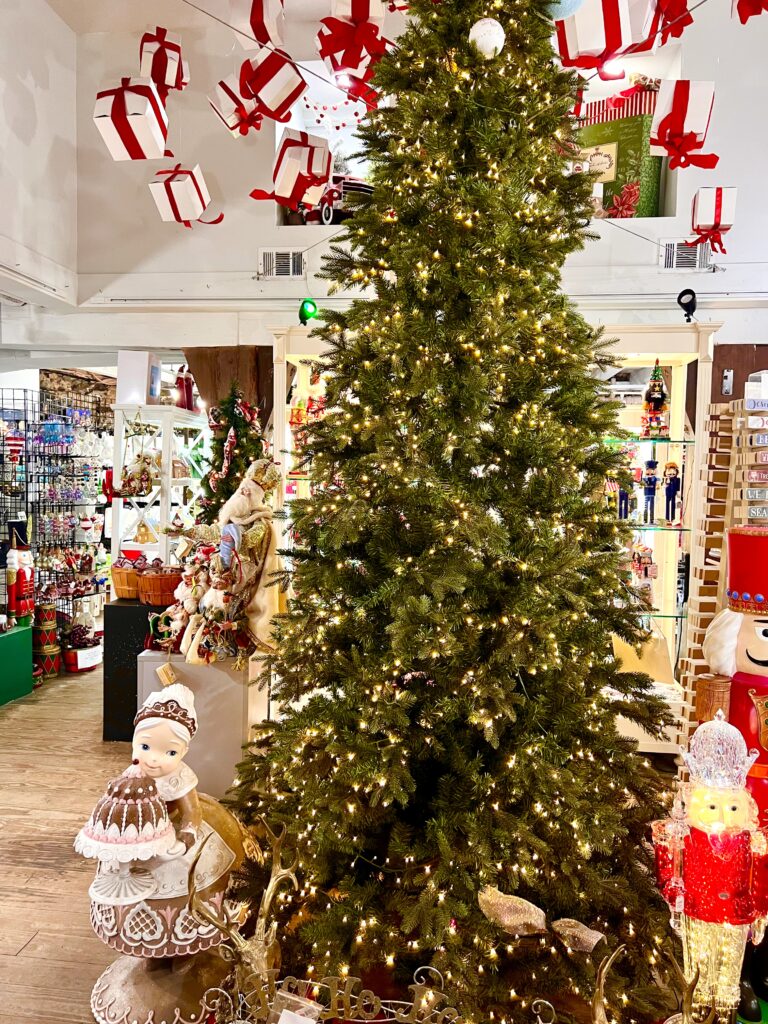interior of savannah christmas store on river street with christmas tree prominent