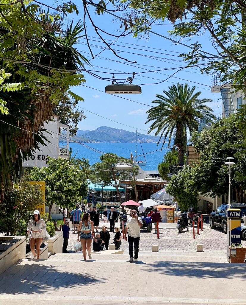 view of a pedestrian street in saranda albania with water visible in the background