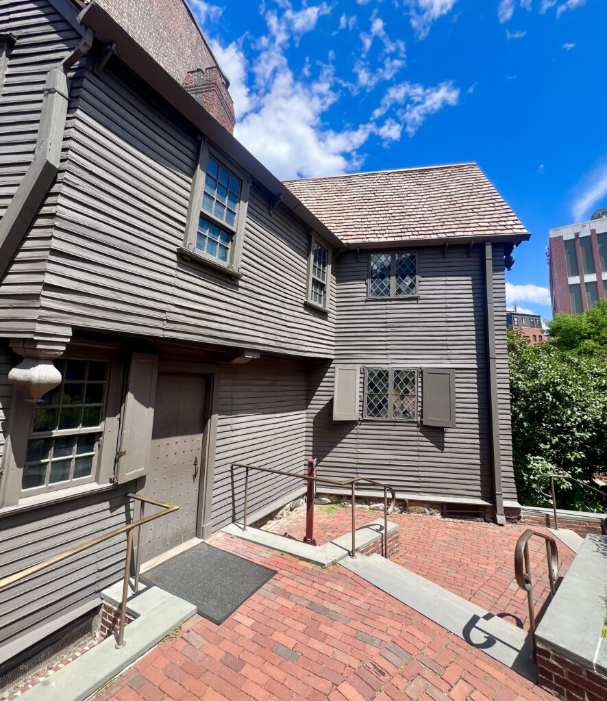 exterior of paul revere house, one of the best things to see in boston north end neighborhood, as seen once inside the gate on a sunny day