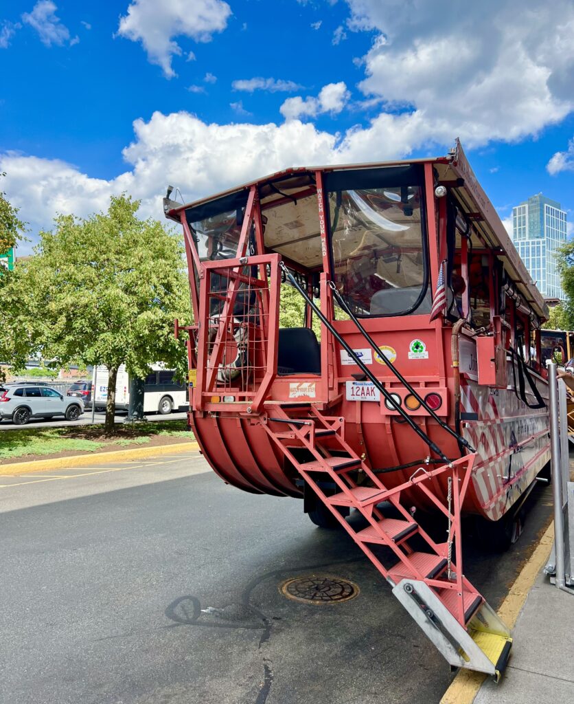 orange boston duck boat parked at the museum of science and ready to board