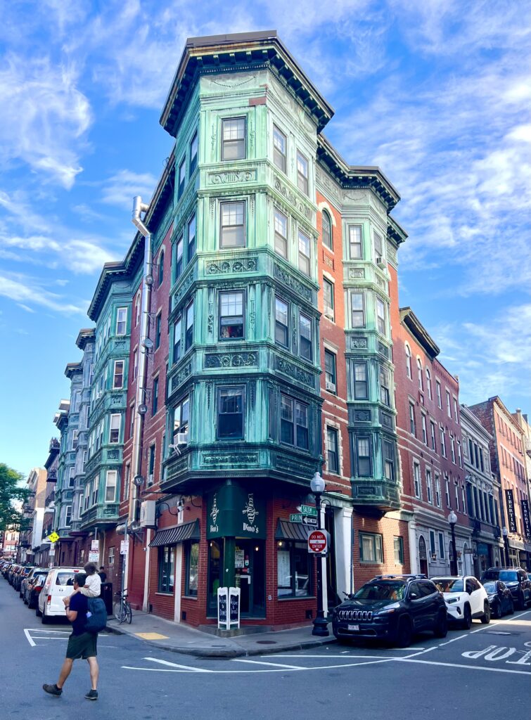 corner of salem and prince streets in boston north end, with jeremy storm and his toddler in the corner